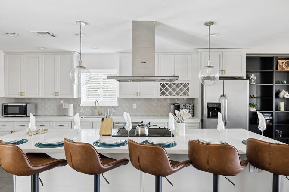 Chef's kitchen - quartz island dining with seating for the whole crew
