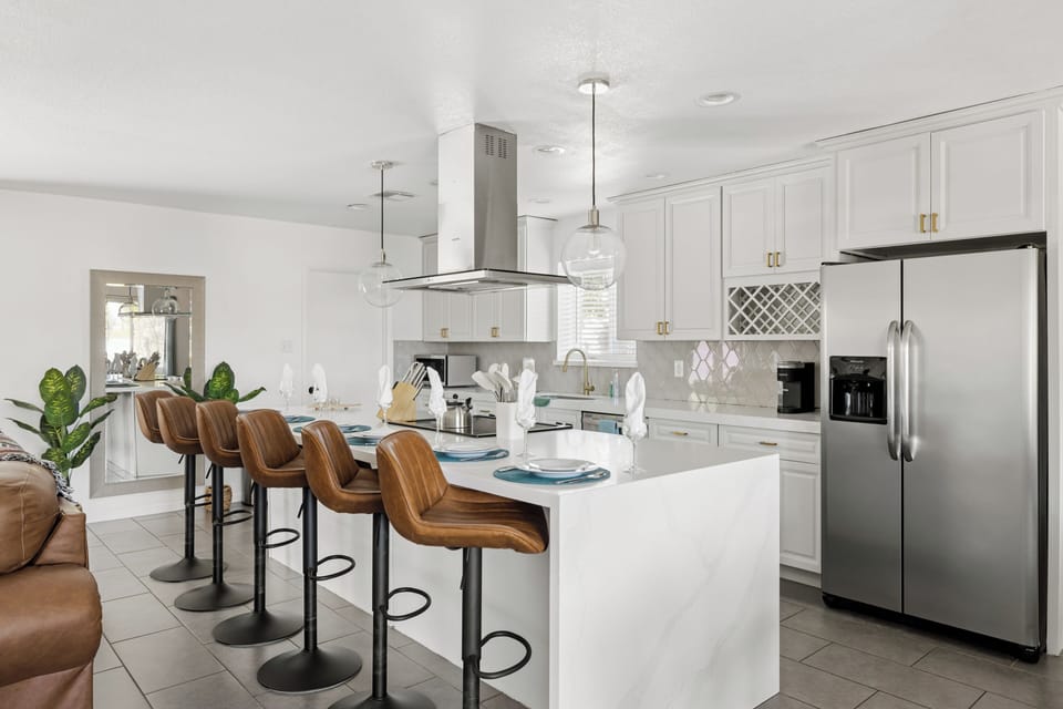 Stainless fridge with ice + water, wine rack and styled shelves