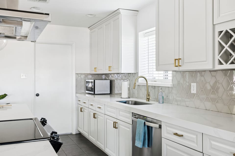 Bright prep space - microwave, dishwasher and everything to feed 12