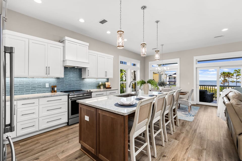 The fully equipped kitchen and oversized island make it easy to cook, gather, and create lasting vacation memories together.