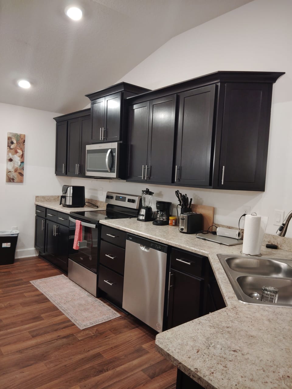 microwave, kitchen visible, indoor, coffee and or coffee maker, kitchen, oven, stovetop