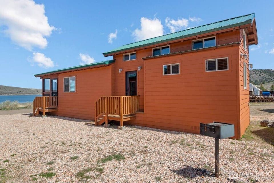 Enjoy the welcoming cabin exterior with a private entrance and easy access to the surrounding grounds.