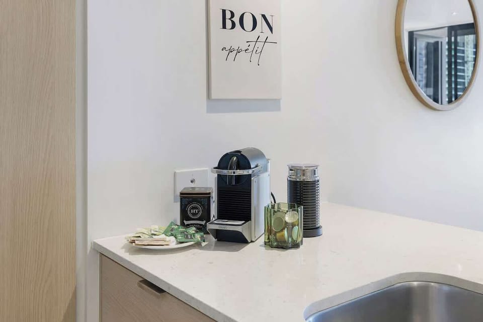 Kickstart your morning by brewing a fresh espresso and frothing milk at the convenient countertop coffee bar.