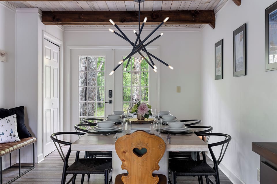 The large dining table is perfect for family meals, puzzles, and board games.
