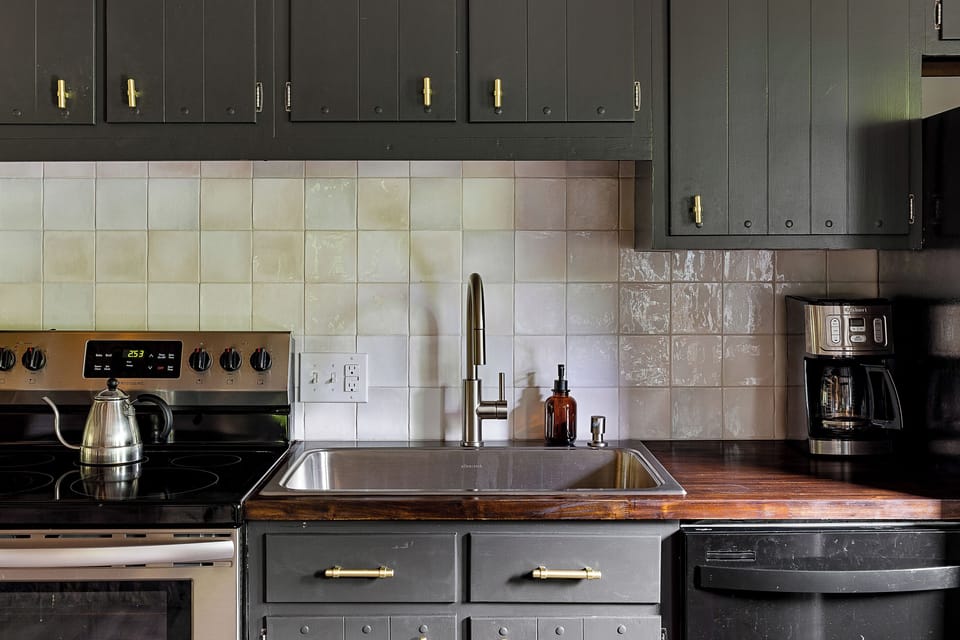 Coffee lovers rejoice- a standard coffee pot, moka pot, and grinder await you. A new deep stainless steel sink and garbage disposal make dinner cleanup a breeze. 
