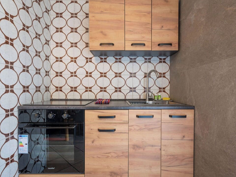 Wood, Flooring, Kitchen, Cabinetry, Floor, Countertop, Brown, Major Appliance, Kitchen Appliance, Wood Stain