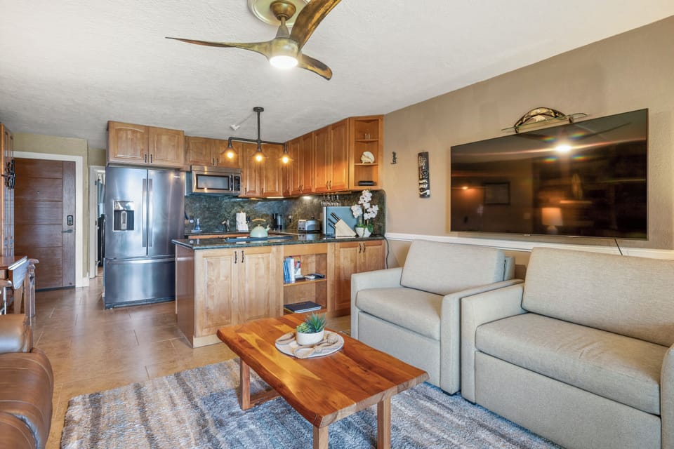 Open floorplan flows from lanai to living room to kitchen.