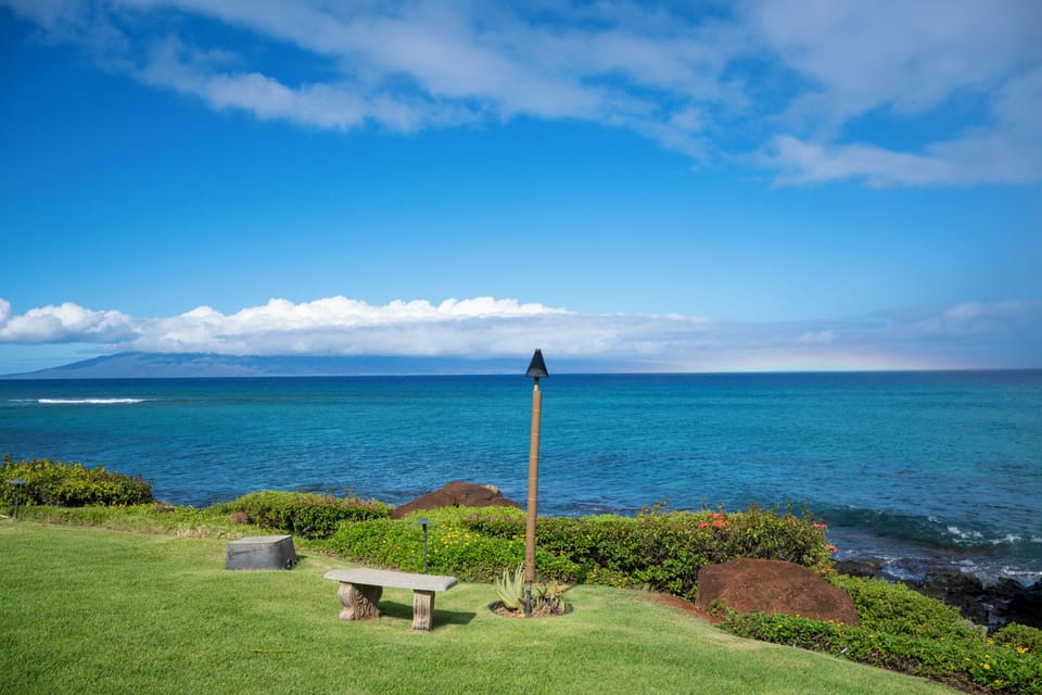 Walk down to the water's edge and relax on the bench where the lawn meets the rocks overlooking the ocean.