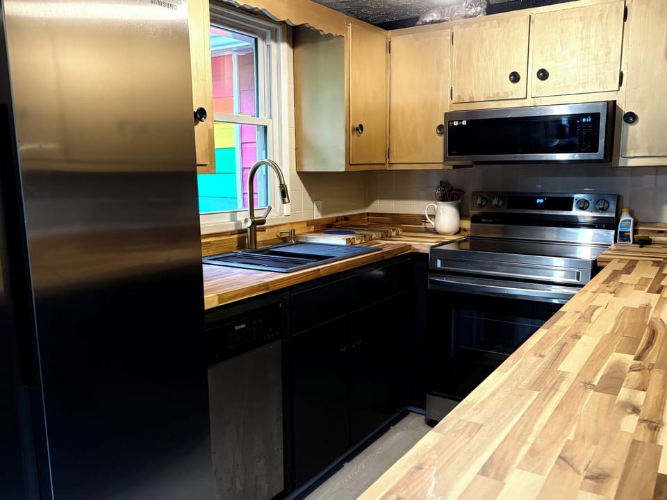 Kitchen (you can see the rainbow I painted on the house out of the window).