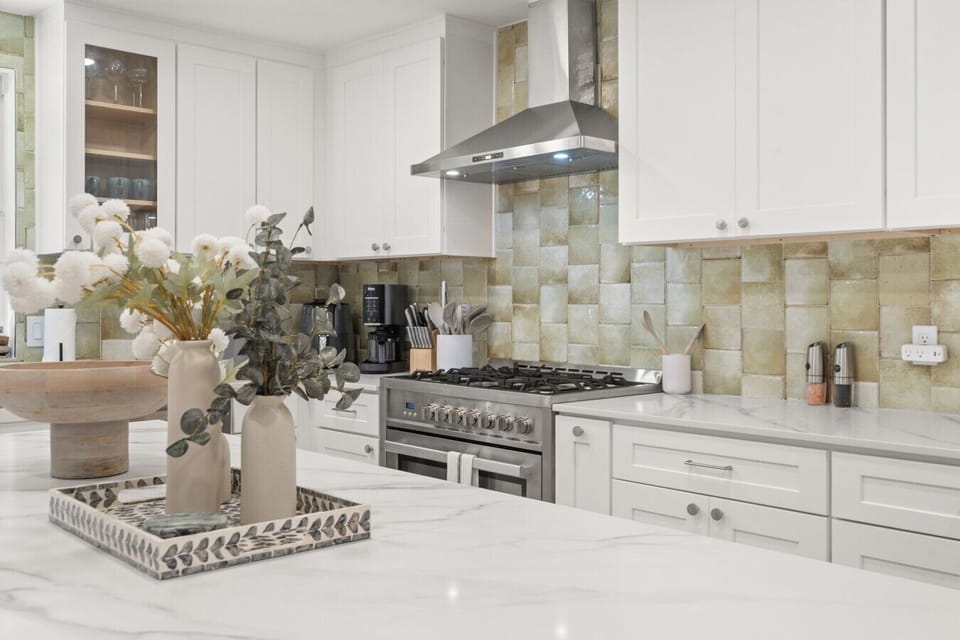 The gas range and generous marble counters give home cooks plenty of room to prepare a full group dinner.