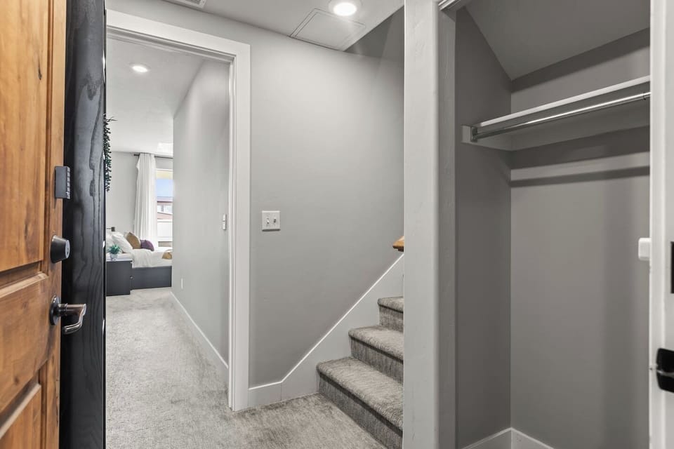 Front door enters on the lower level.  This shows the stair going to the upper level as well as the lower level bedroom