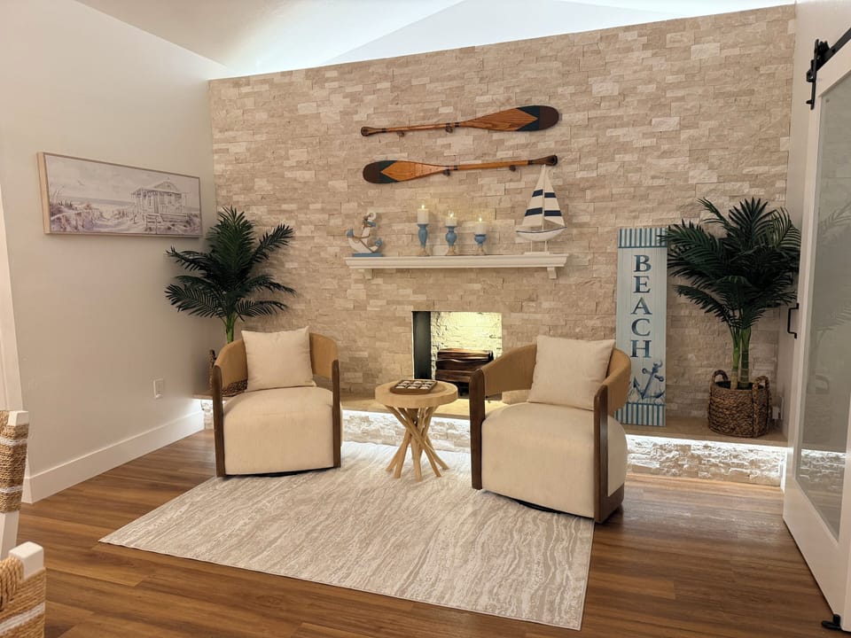 Cozy coastal sitting area with fireplace—perfect for relaxing and unwinding