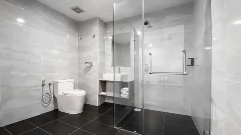 Shower, hair dryer, towels, toilet paper