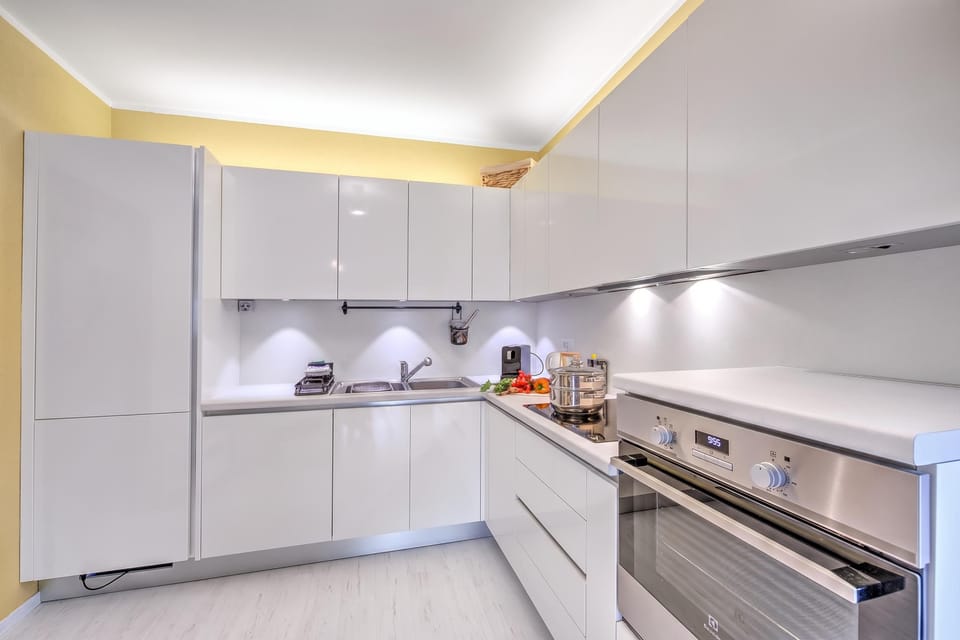 Family Apartment, 2 Bedrooms, Microwave, Lakeside (Emotion Lake Lugano with direct lake) | Private kitchen | Coffee/tea maker, electric kettle
