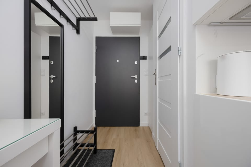 Entrance area of the studio with a modern hallway, wardrobe, and practical storage space.