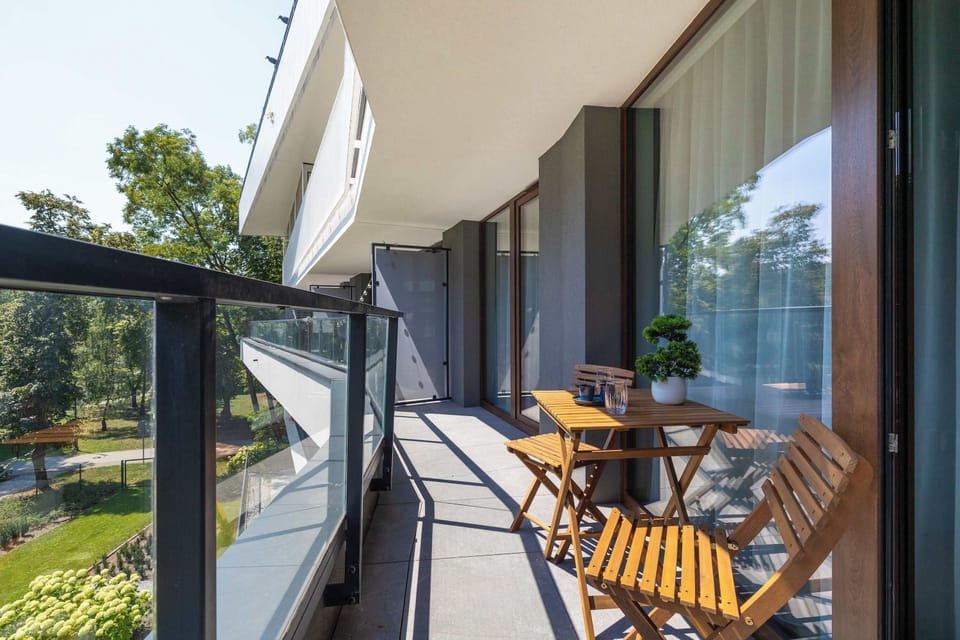 Balcony with outdoor seating, perfect for relaxing with a morning coffee.