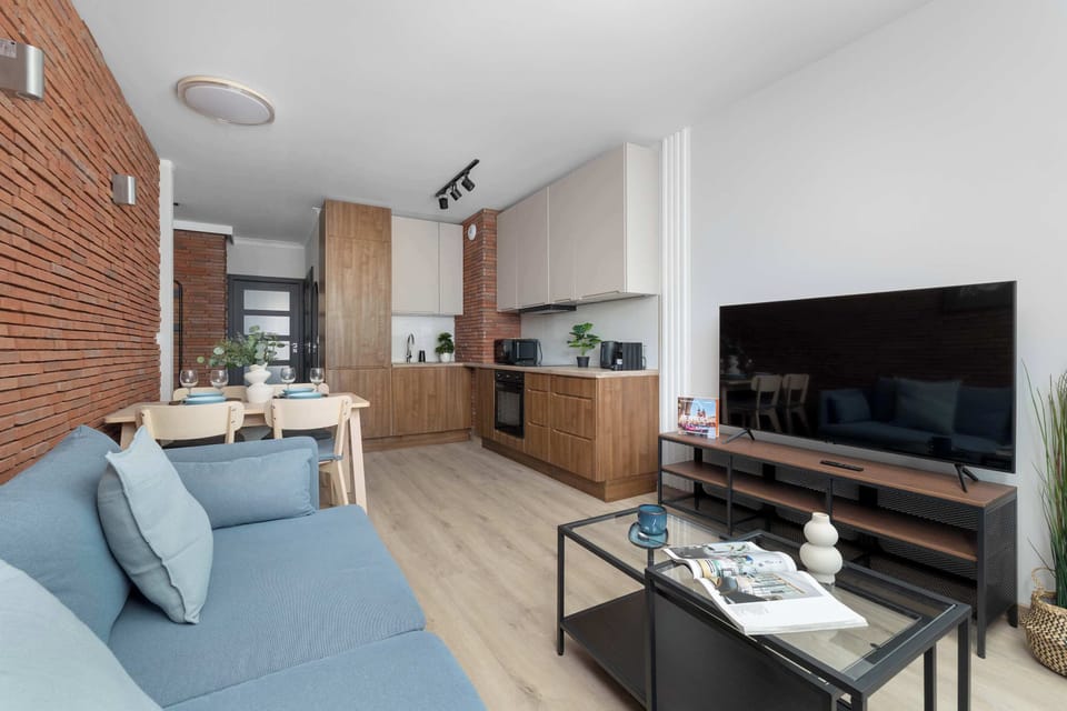 Spacious open-plan living room connected to the dining area and kitchen.