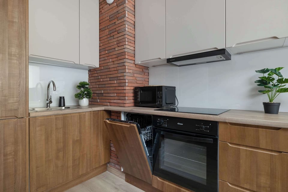 Modern kitchen with built-in oven, induction hob, and generous workspace.