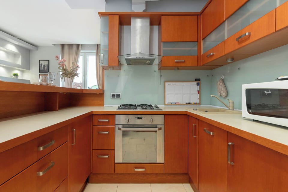 The sleek design of the kitchenette blending seamlessly with the living area.