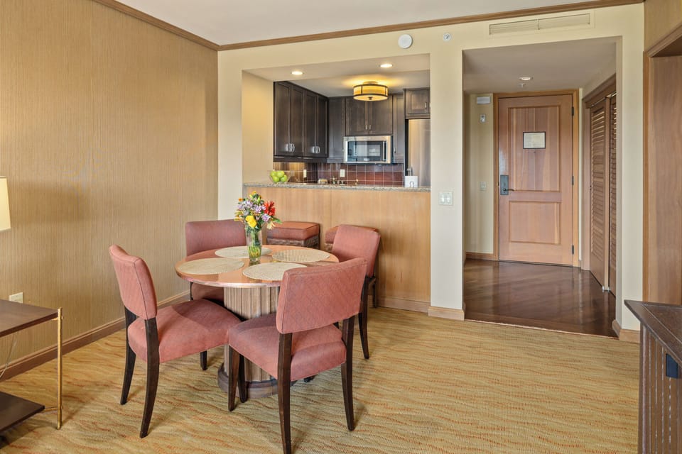 Cozy dining area with kitchenette and seating for four