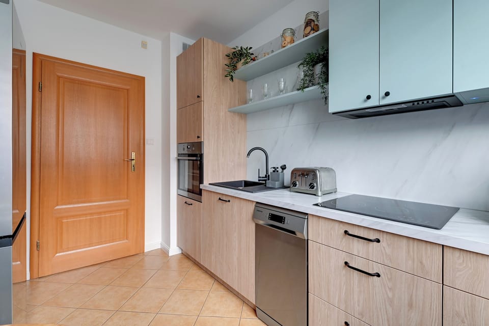 Family Apartment, Balcony | Private kitchen | Coffee/tea maker, microwave, electric kettle, toaster