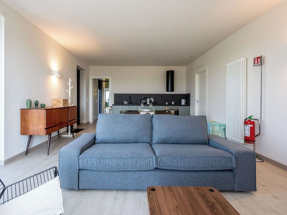 Furniture, Interior Design, Couch, Flooring, Wall, Floor, Wood, Table, Living Room, Room