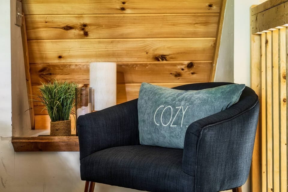 A cozy little sitting area near the bed