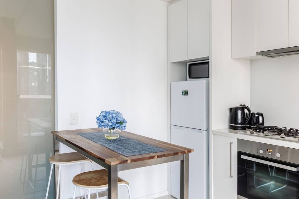 Share a quiet meal or plan your day at the compact dining nook, perfectly positioned beside the kitchen for simple, home-style convenience.
