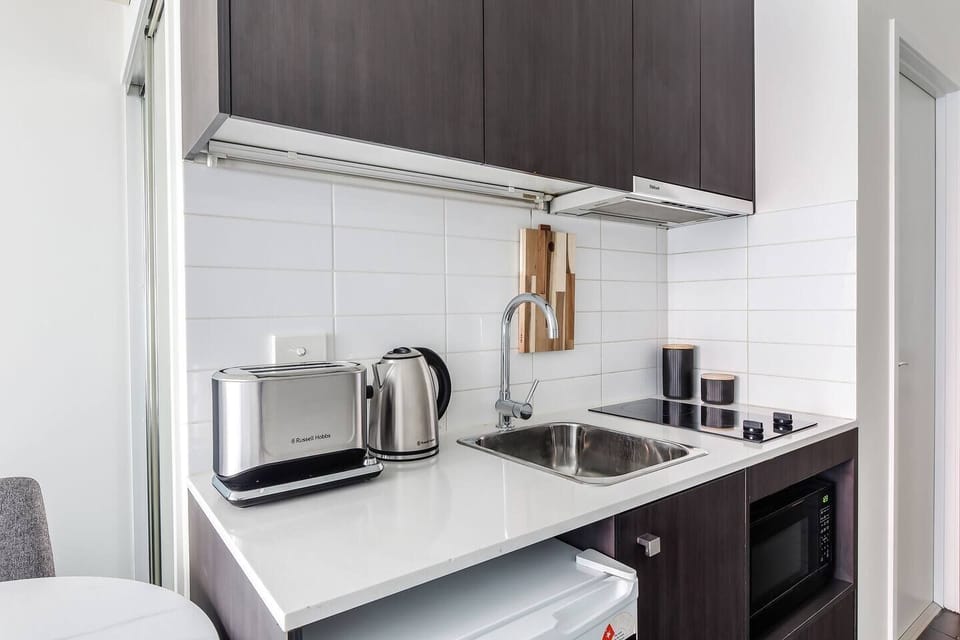 Prepare breakfast or quick bites in the kitchenette, complete with a stove, microwave, toaster, kettle, mini fridge, cookware, and all the essentials.