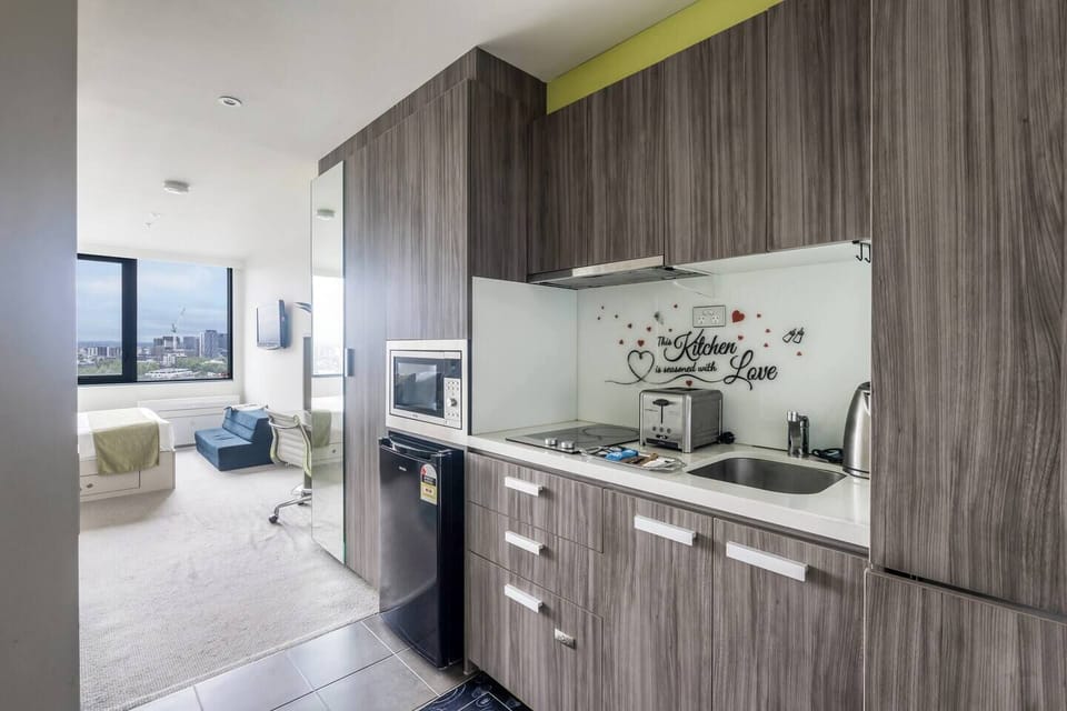 A compact yet well-appointed kitchenette is kitted for convenience, complete with essential appliances.