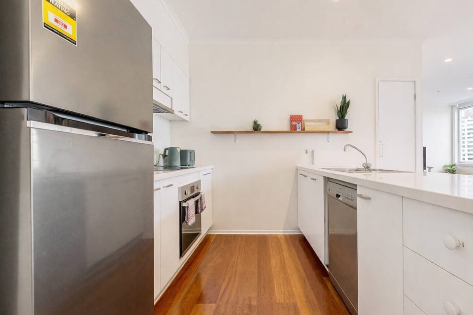 Cook up your favourite meals in the fully equipped kitchen featuring modern appliances, ample bench space, and thoughtful touches for home-style convenience.