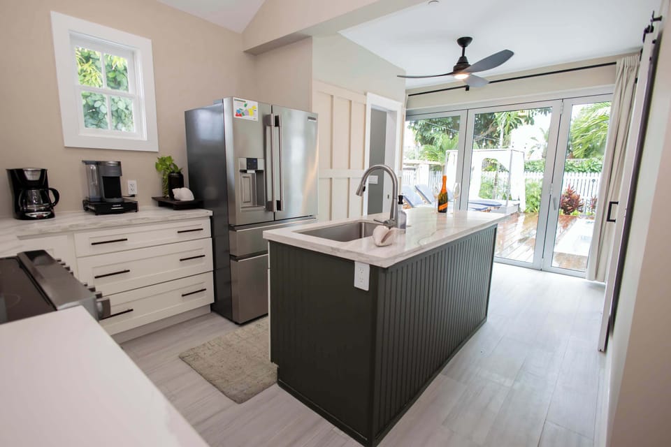 Fully Equipped Kitchen with Pool and Amenities View