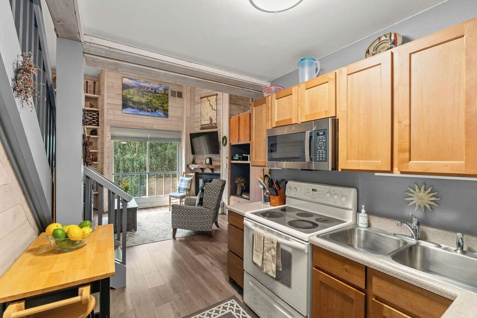 Open kitchen flows into a bright living area with balcony views