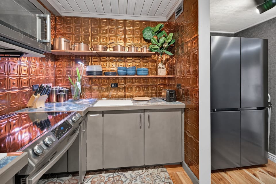 The fully equipped kitchen has everything you need to prepare meals during your stay.
