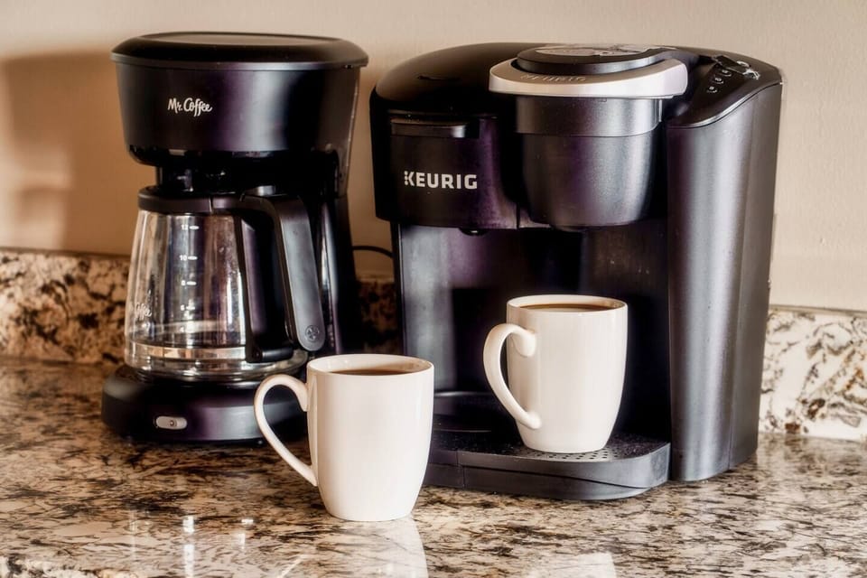 We offer a Keurig coffee machine as well as a regular drip coffee machine. While there may be some kcups available from prior guests, we do ask that you bring your favorites. If you happen to forget, there's a market 5 minutes down the road.