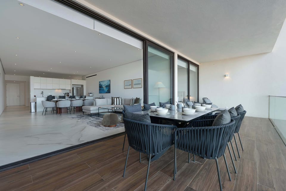 Covered terrace with outdoor dining area.