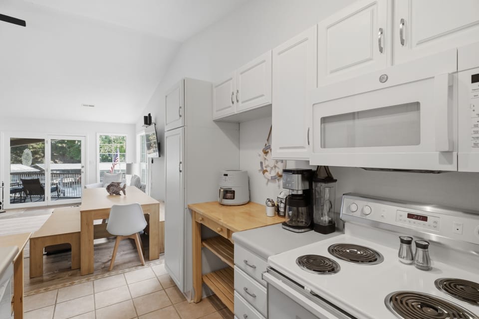 Open galley style kitchen with adjacent dining area