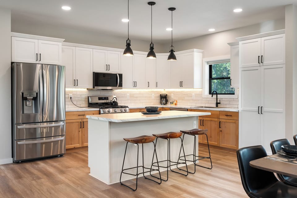 Spacious Fully Equipped Kitchen with Stainless Steel Appliances
