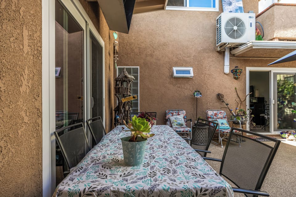 Enjoy al fresco meals or morning coffee on the patio dining table right outside your sliding doors.