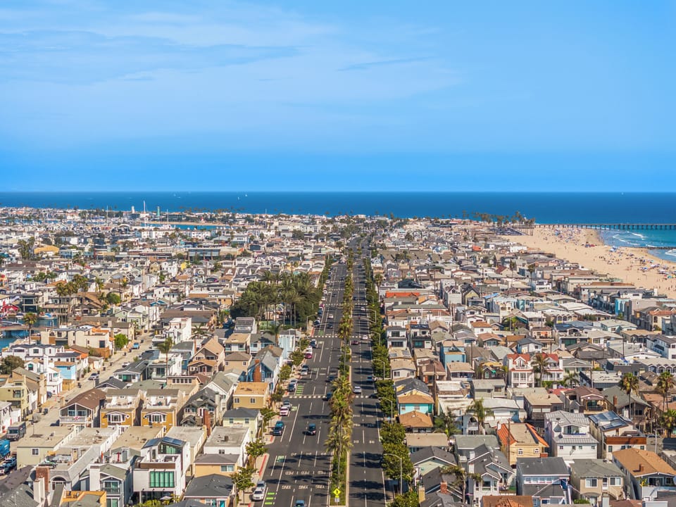 Bird's-eye view of West Newport Beach, showcasing how close you are to the sand, boardwalk, and surf.