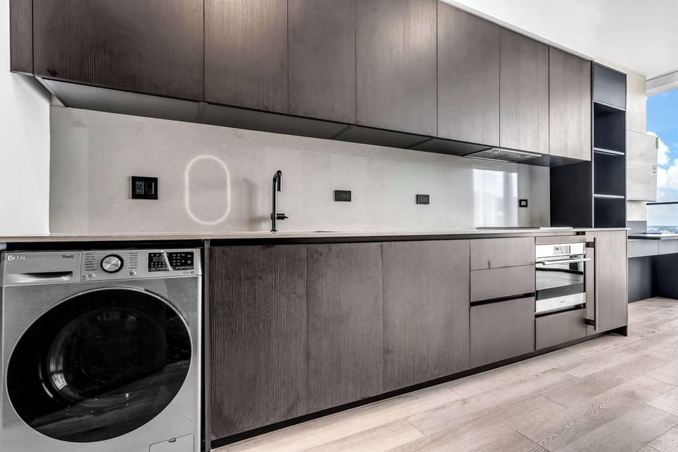 Private laundry is available for your stay, tucked away in the kitchen​