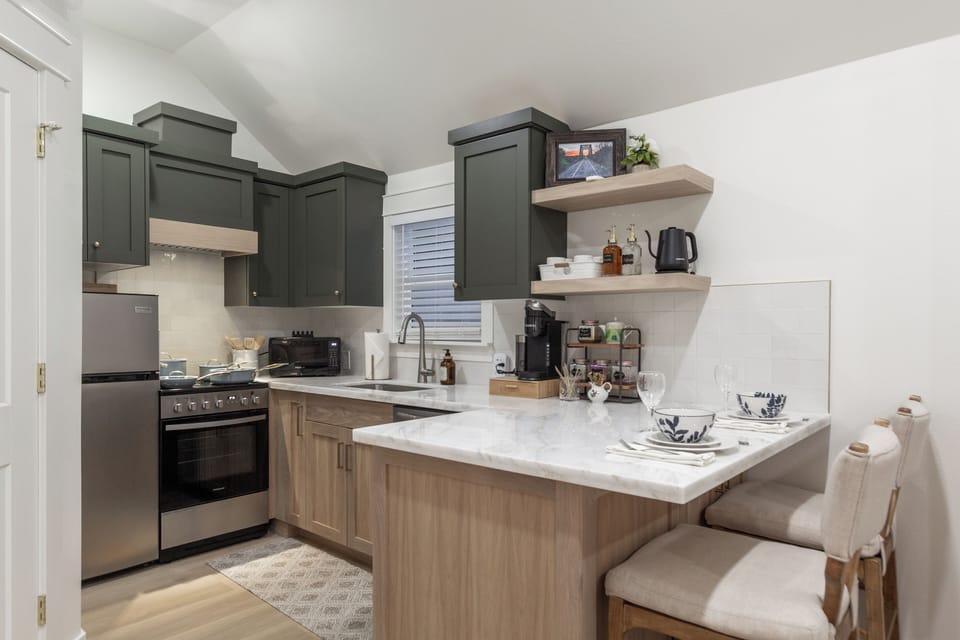 Stylish modern kitchen with breakfast bar and cozy coffee station