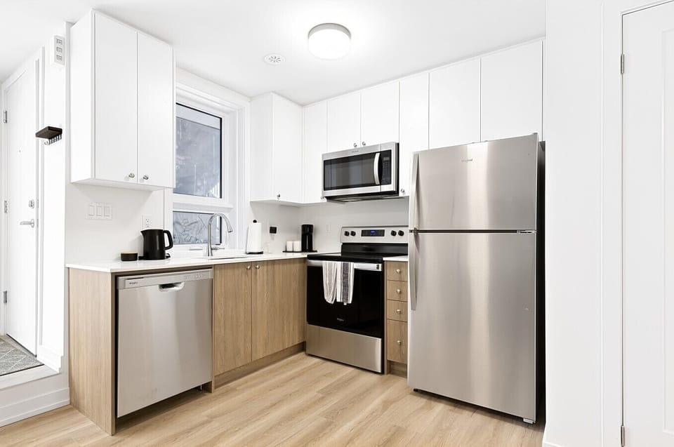 Cook with ease in the fully equipped modern kitchen featuring stainless steel appliances, generous cabinetry, and everything you need for both short and extended stays. Whether you`re preparing breakfast before meetings or enjoying a home-cooked dinner, t