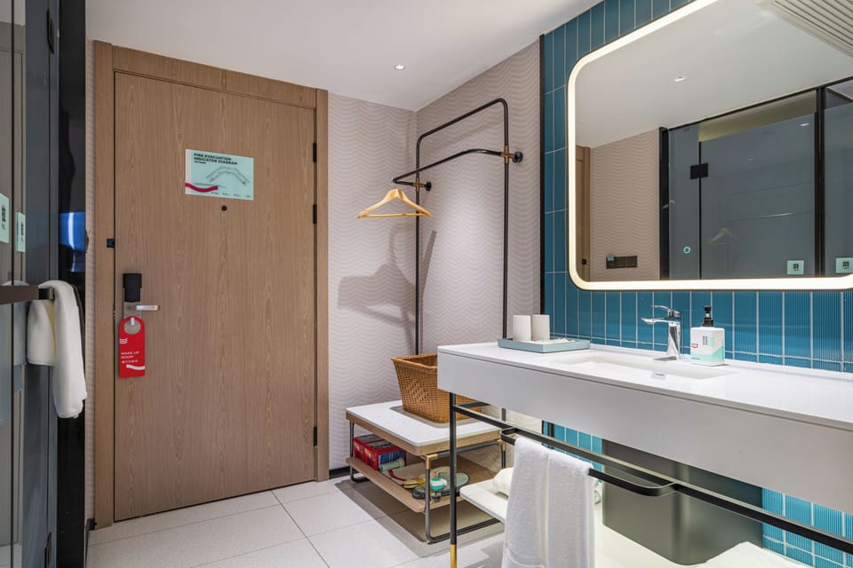 Shower, hair dryer, slippers, towels