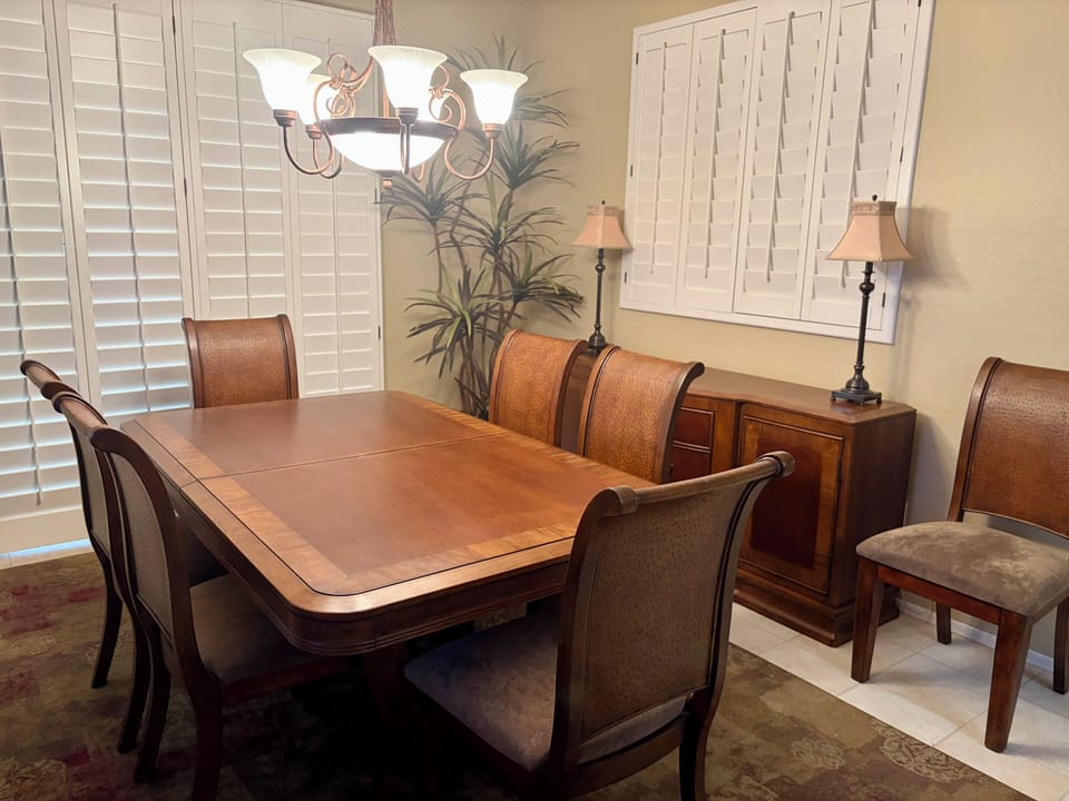 Dining room table & chairs, side buffet with placemats and serving items