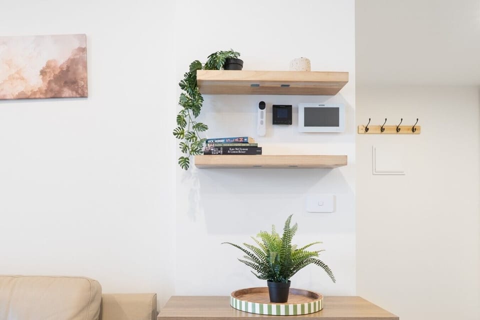 A warm and inviting living space with contemporary touches, comfortable furnishings and thoughtful décor — the perfect spot to settle in after a day out.