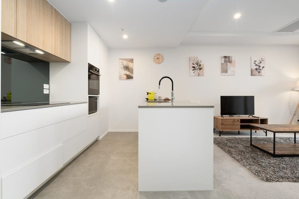 Cook with ease in this bright, modern kitchen, featuring plenty of bench space, quality appliances and a welcoming open-plan layout.