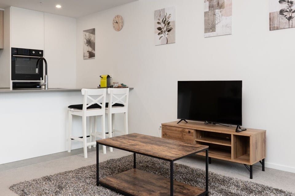 Put your feet up and unwind in this beautifully styled living room, complete with comfortable seating and a calming, contemporary atmosphere.