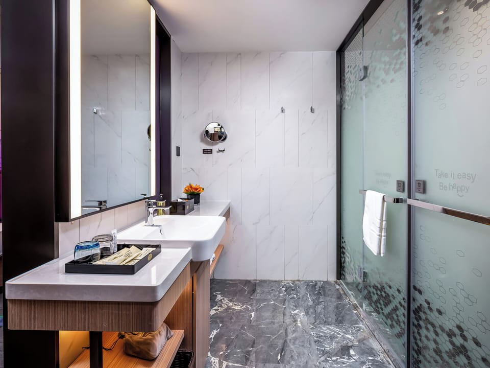 Shower, hair dryer, slippers, towels