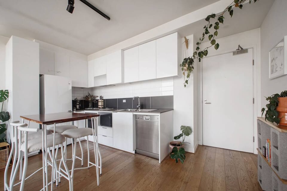 The streamlined kitchen is fully equipped to cook meals at home.